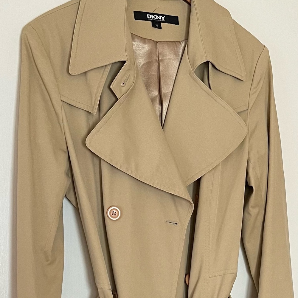 DKNY tan trench coat with button down front and belt